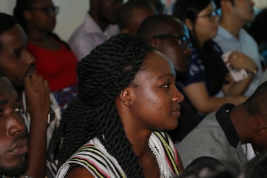 A group of people watching a service on their devices at home.