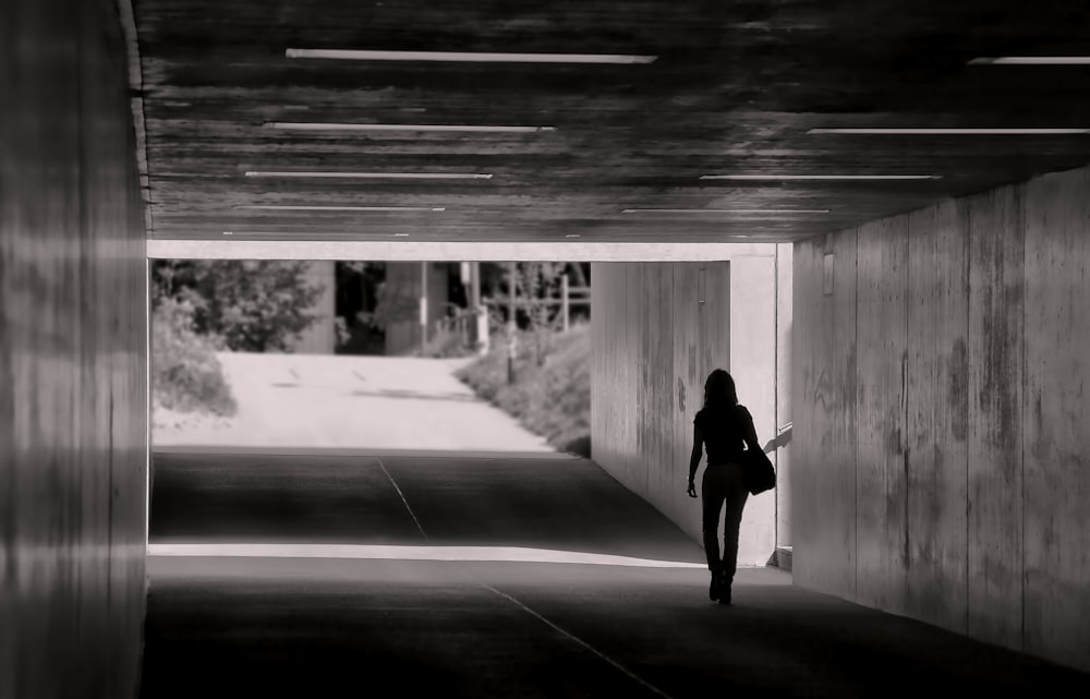 silhouette photography unknown person walking outdoors