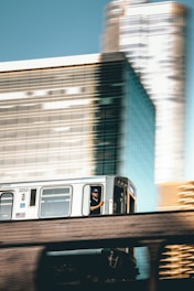focus photography of person riding gray train