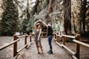 man and woman dancing between brown wooden handrails