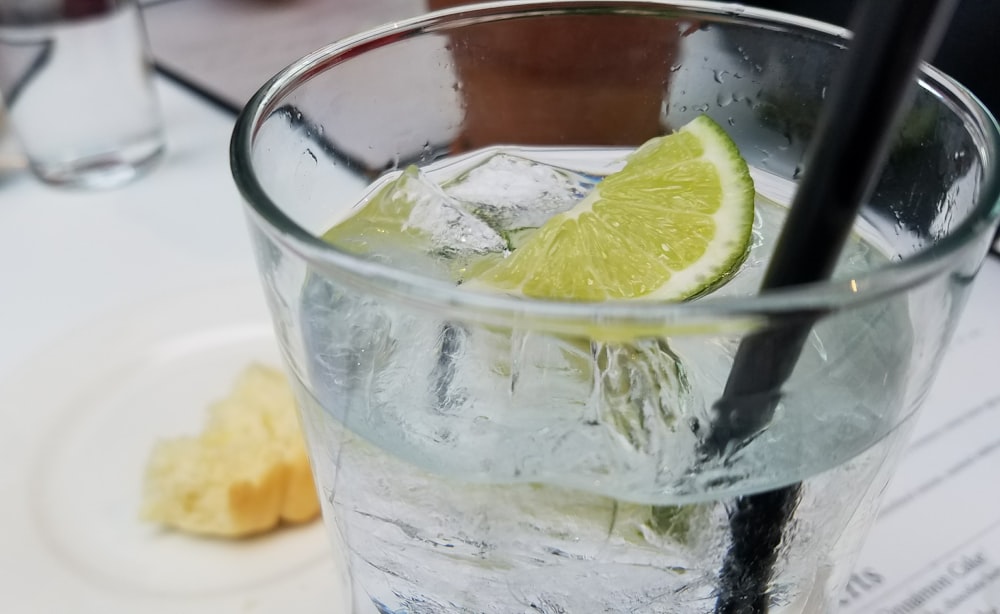 clear drinking glass with lemon slice