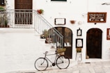 black bicycle near handrails at daytime