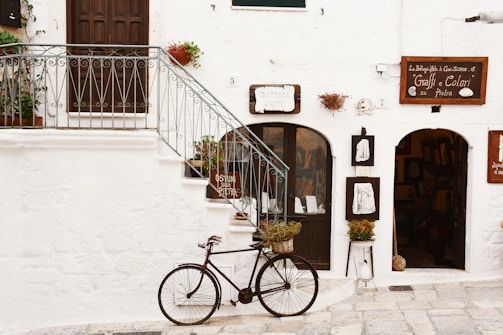 black bicycle near handrails at daytime