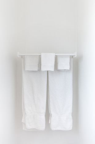 Happy customers receiving freshly laundered gym towels.