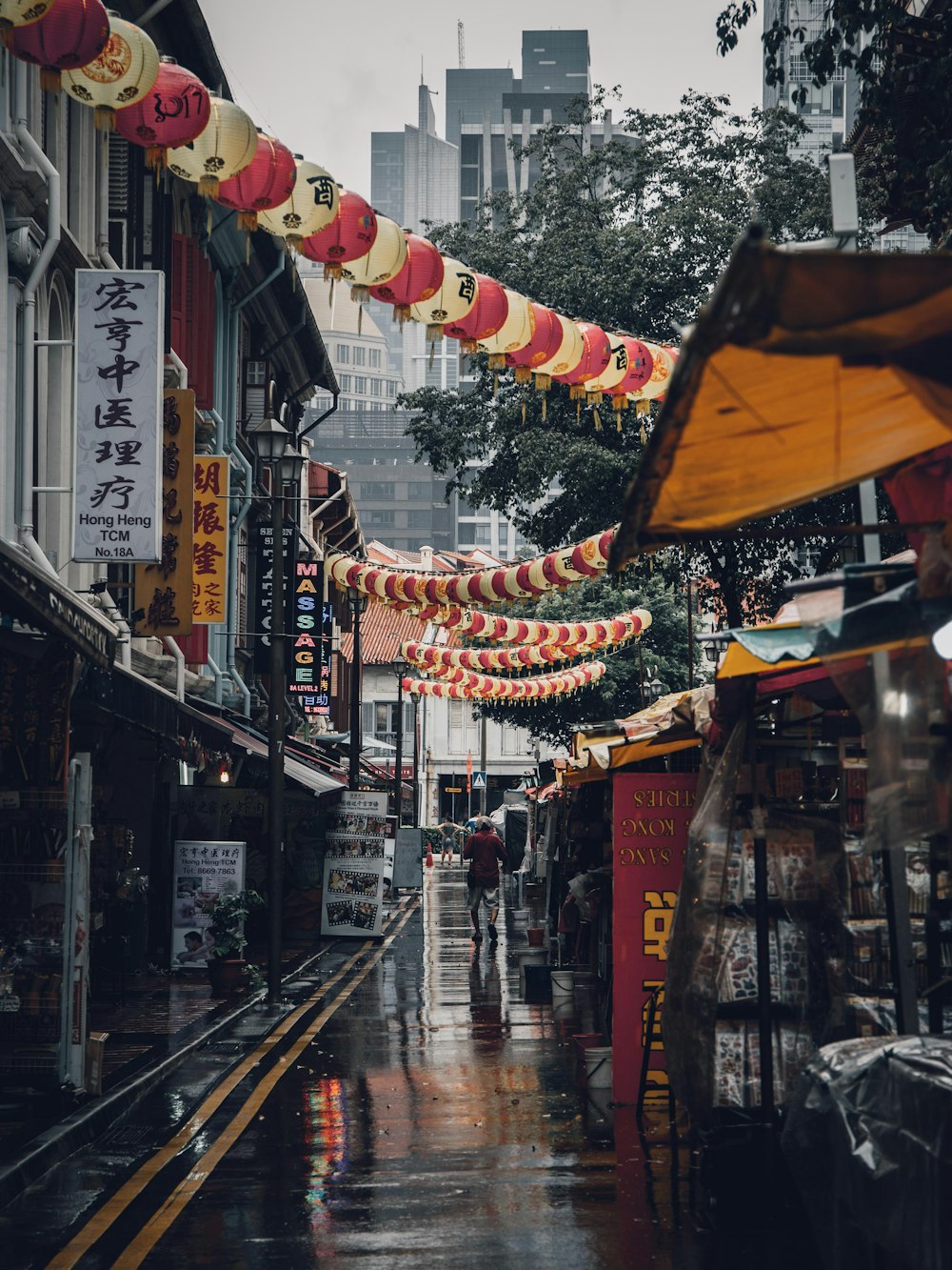 assorted lanterns hanged above alleyway