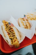 closeup photo of two hotdogs on tray