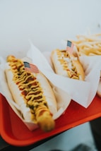 closeup photo of two hotdogs on tray