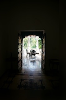 An elegant patio door opening to a lush garden.