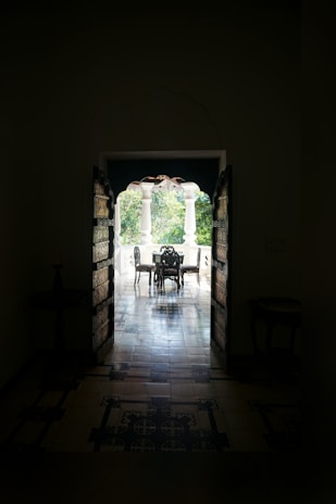 An elegant patio door opening to a lush garden.