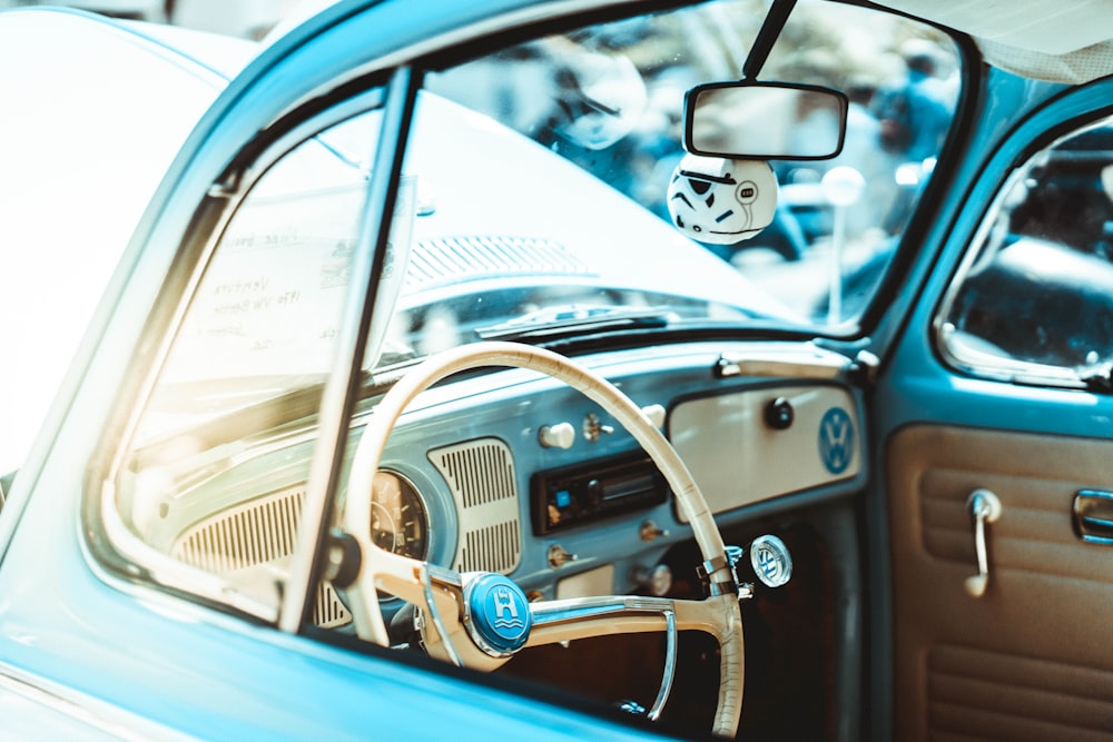 shallow focus photography of white car steering wheel