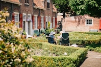 Elderly residents enjoying a sunny garden at the home for old age people.