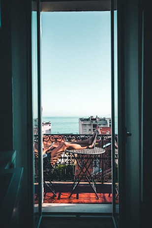 person sitting on balcony