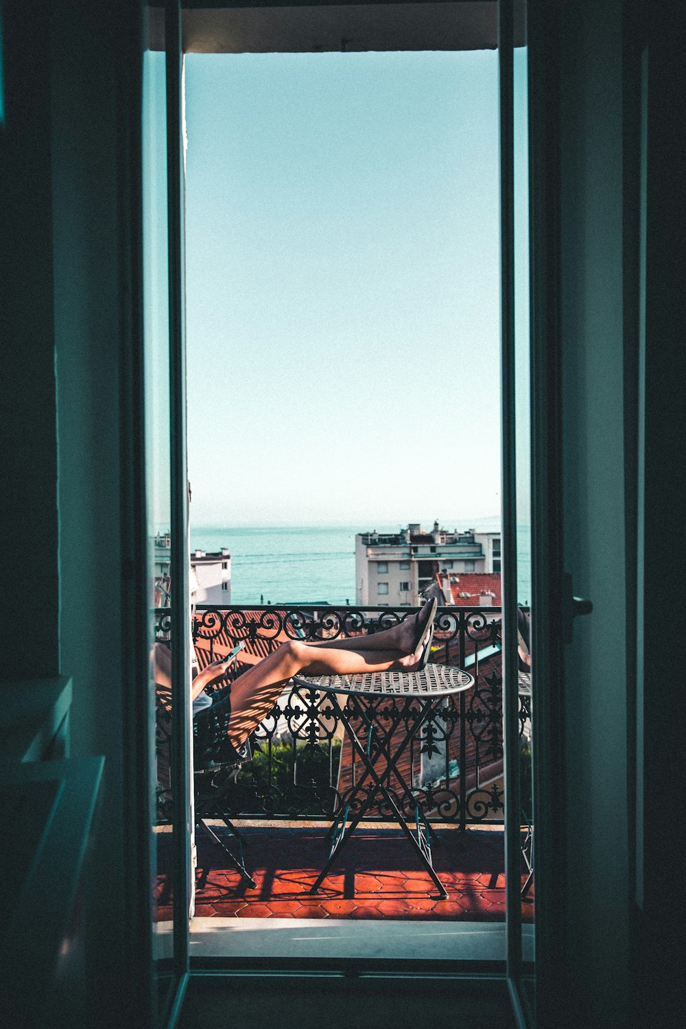 person sitting on balcony