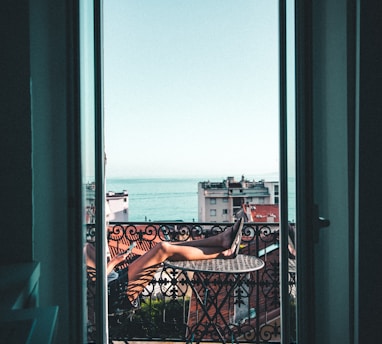 person sitting on balcony