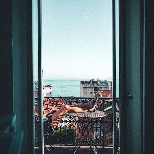 person sitting on balcony