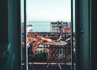 person sitting on balcony