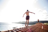 man walking on house roof