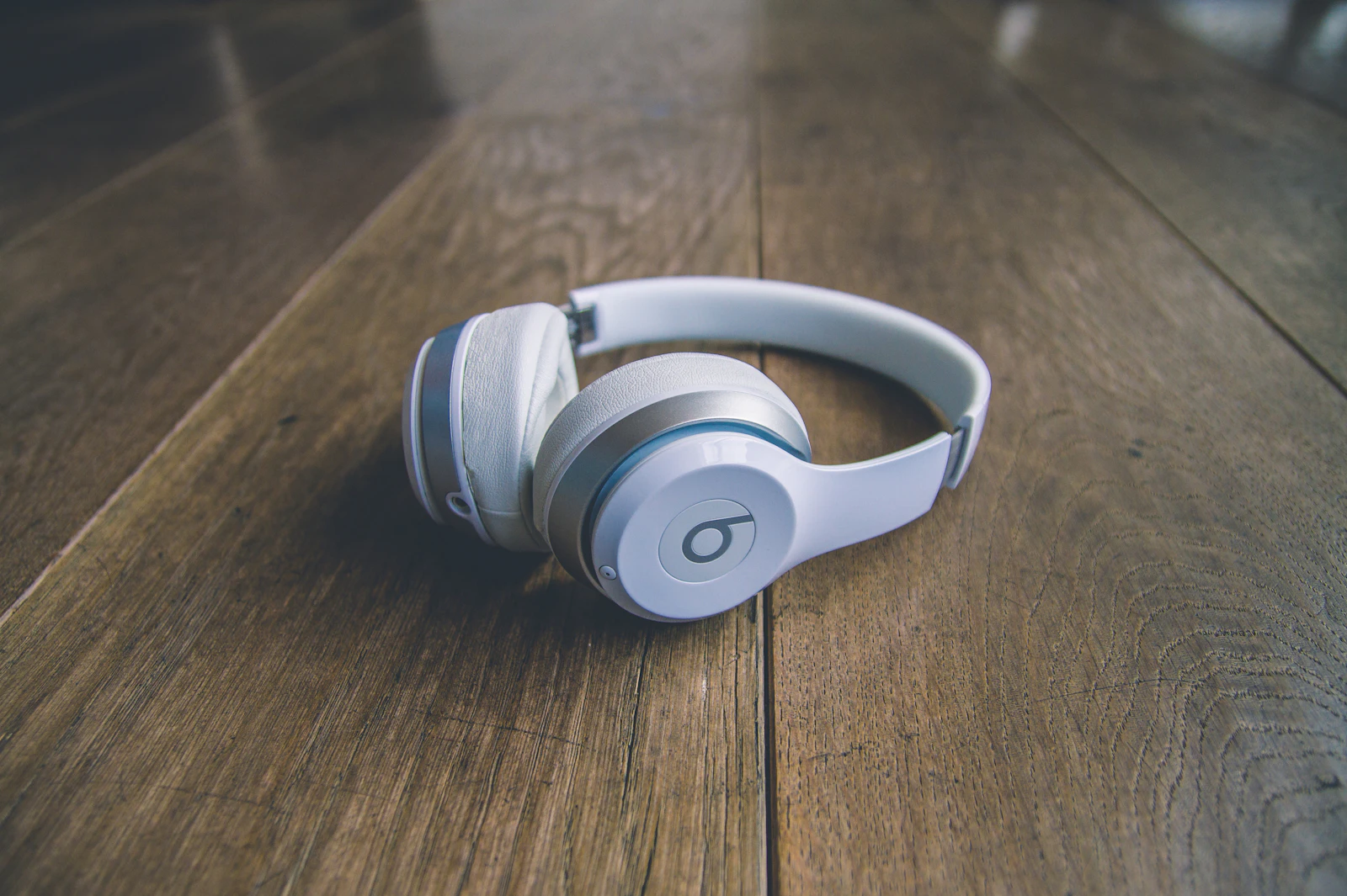 Open journal with handwritten notes and pen on a wooden desk