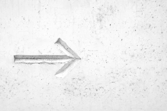 right arrow sign on wall