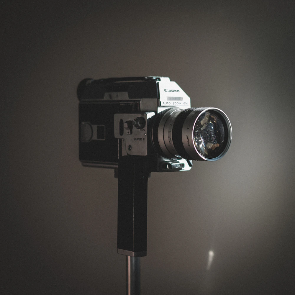 A projector throwing a single beam of light through haze.