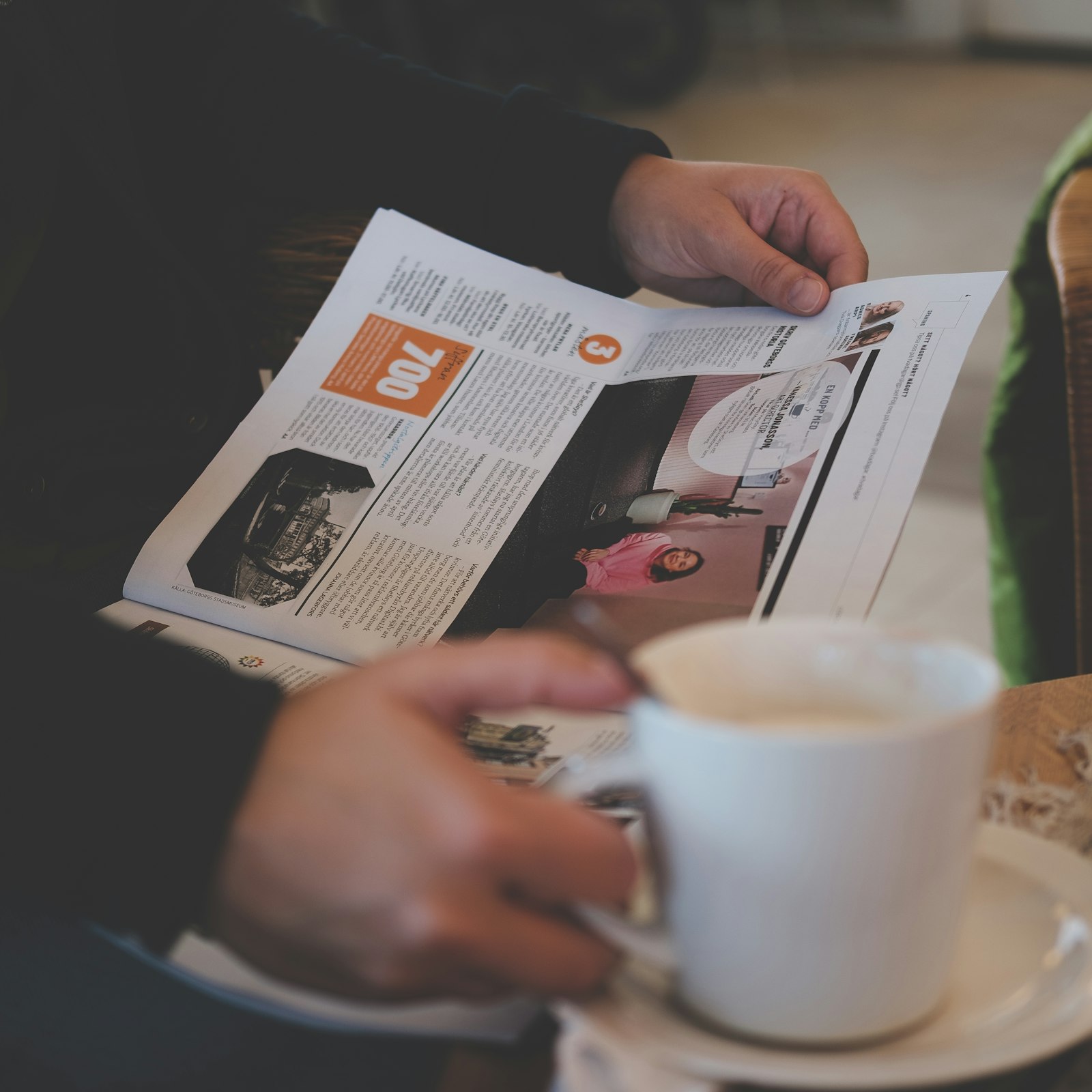 Fujifilm XF 35mm F2 R WR sample photo. Person reading while holding photography