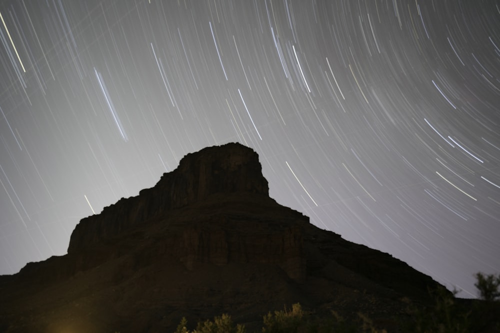 photo of mountain and star trail