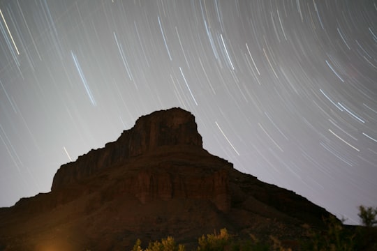 photo of mountain and star trail in Moab United States