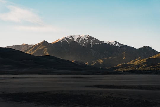 mountains during daytime in Great Sand Dunes National Park and Preserve United States