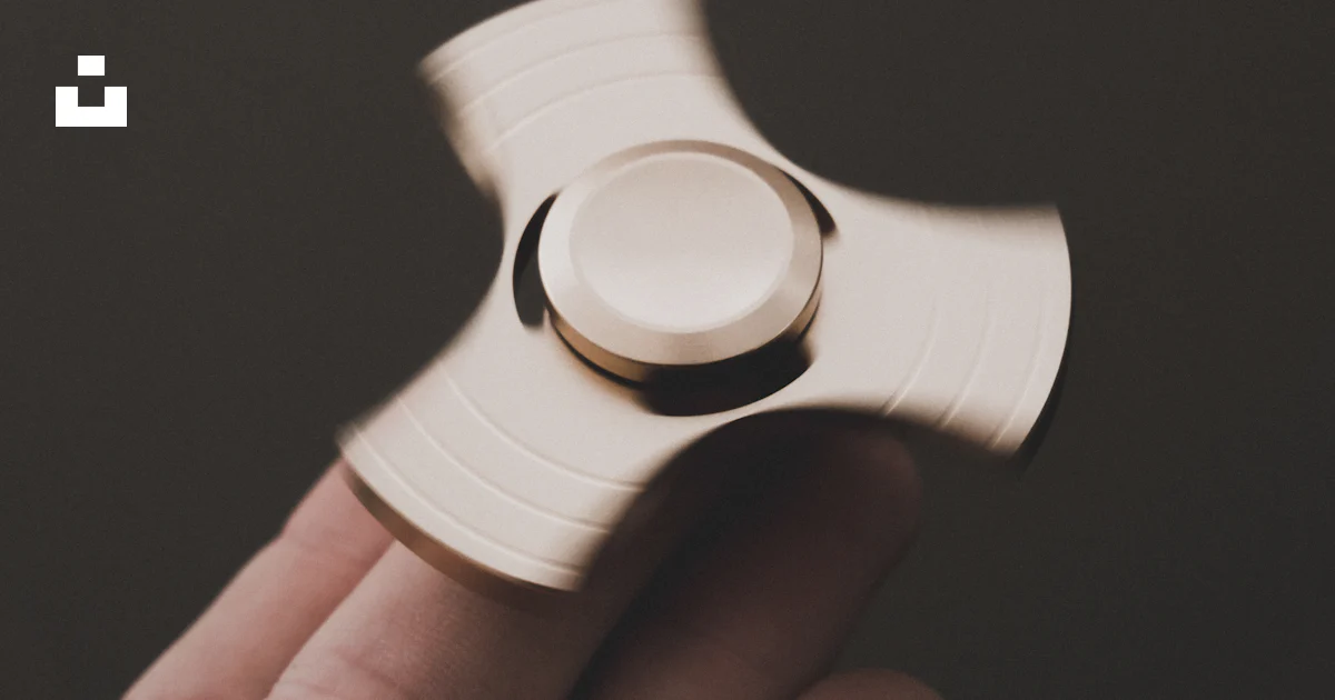 Person holding brown 3-blade fidget spinner photo – Free Grey Image on ...