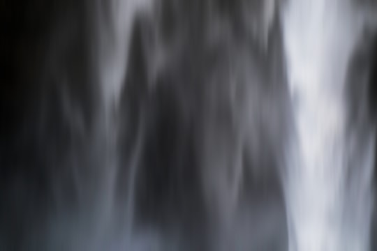 Black and white blurred close up shot of Seljalandsfoss waterfall in Seljalandsfoss Iceland