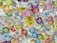 Close-up of a colorful custom sticker sheet with varied shapes and sizes.