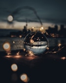 A sophisticated crystal ball illuminated by soft golden light.