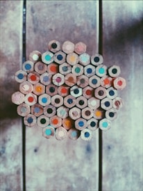 A collection of completed colored pencil drawings ready for sale.