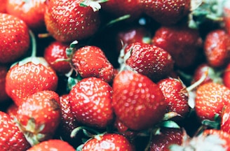 Close-up of ripe strawberries freshly picked, showcasing their natural red color.