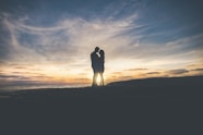 man and woman hugging each other