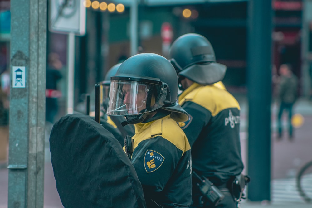 two men wearing helmets