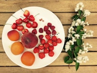 A wooden table adorned with fresh fruits and vegetables.