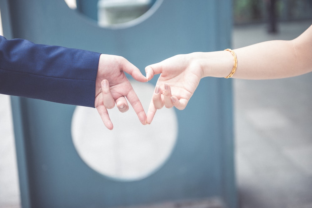 couple making heart shape with their hands