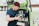 A barista preparing coffee inside a mobile café truck.