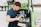 Barista preparing espresso at a stylish mobile coffee bar during an outdoor event.