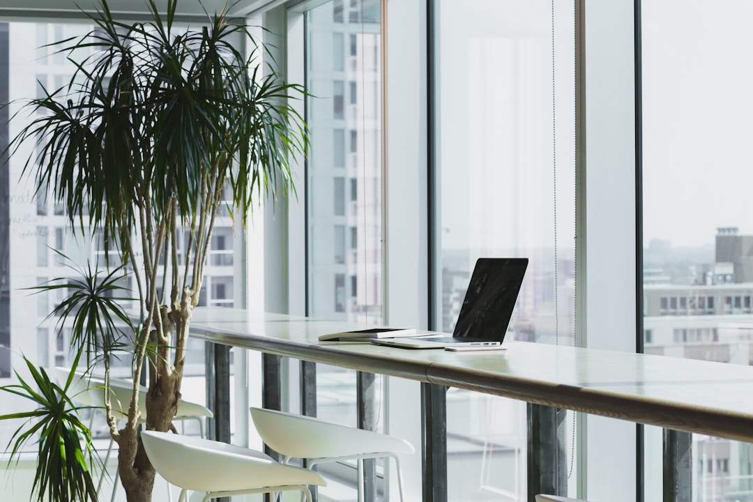 An office space featuring a laptop, illustrating how modern businesses utilize online fax services for streamlined operations.