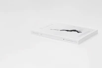Close-up of a luxurious magazine cover with subtle gold accents and minimalist typography.