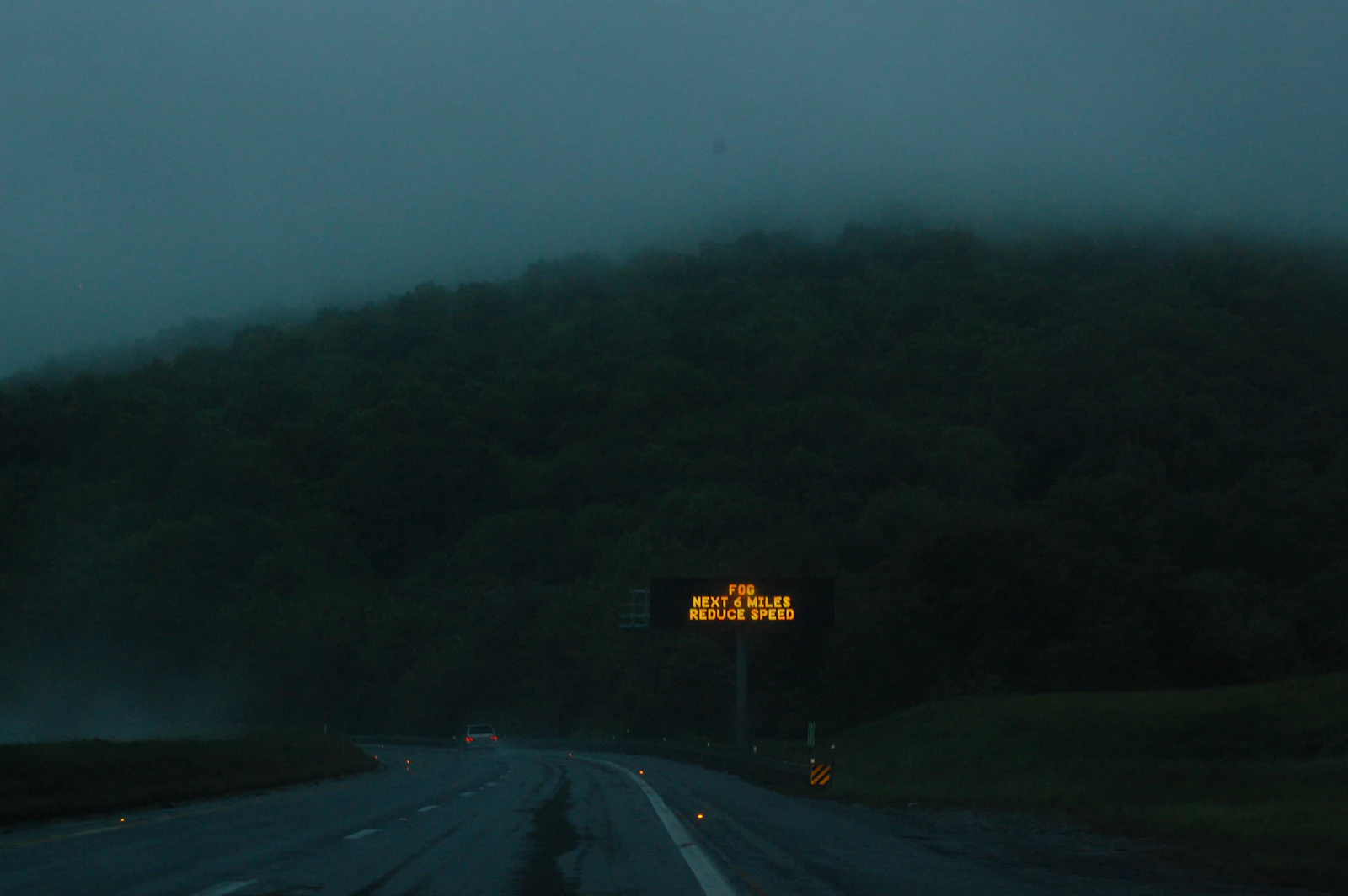 Fog drifting over a mountain slope