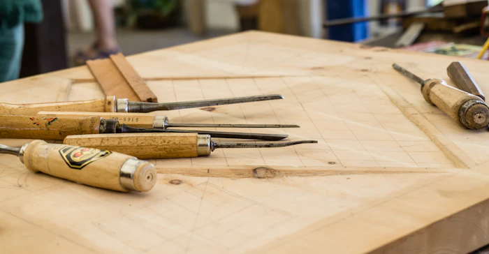 Carpenter applying finishing touches to custom cabinetry
