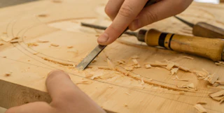 Chisel and shavings on the bench. Stock image, placeholder.
