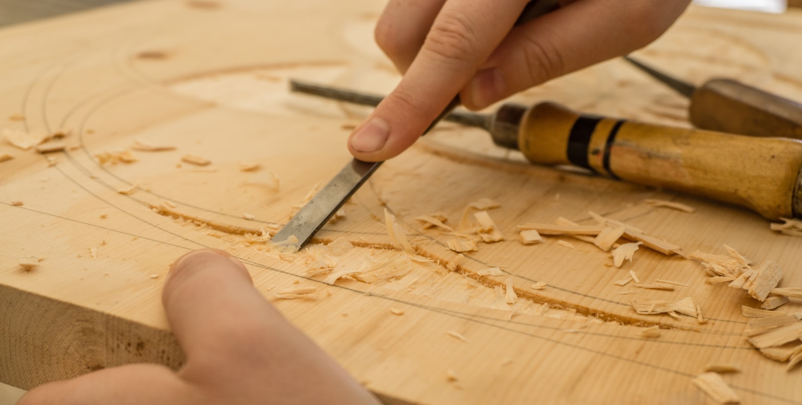 Person carving a wood