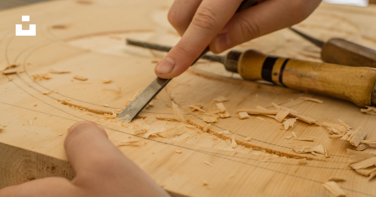 Person using chisel while curving wood photo – Free Wood Image on Unsplash