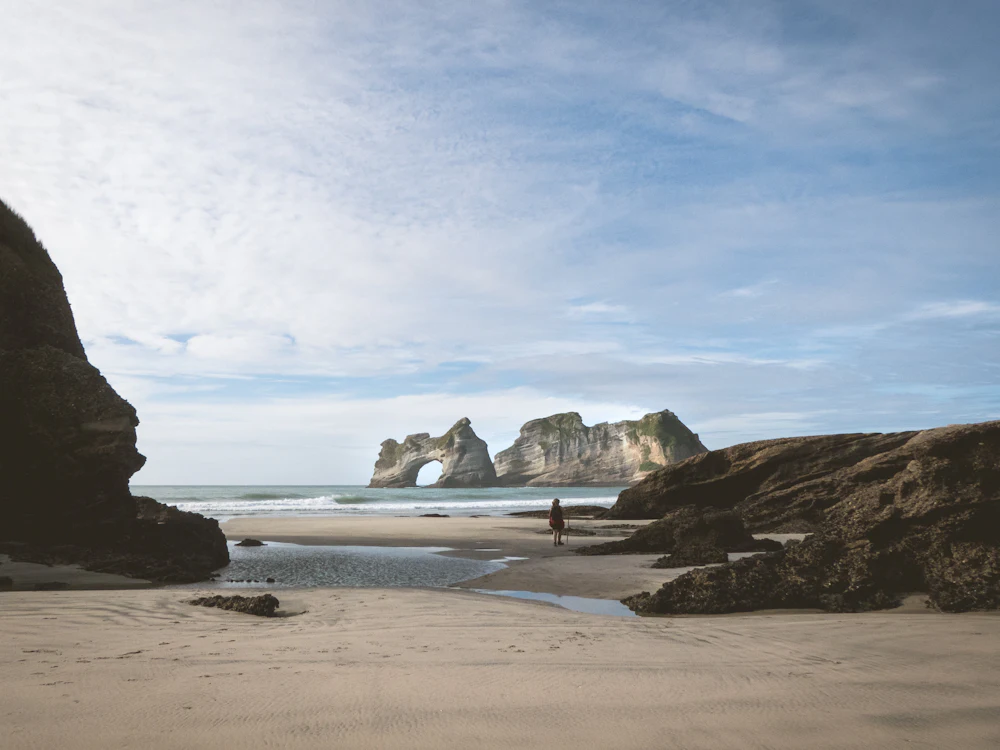 Wharariki Beach, Puponga — a real, location-matched photo.