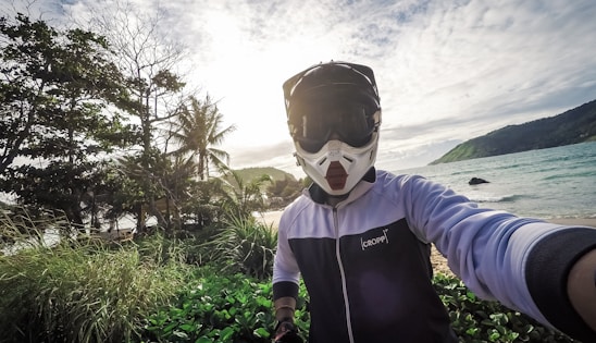 A vibrant shot of a rider on a Surron HyperBee tearing through a lush tropical trail on Koh Samui.