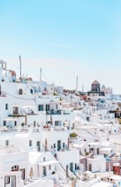 white concrete houses under blue sky at daytime